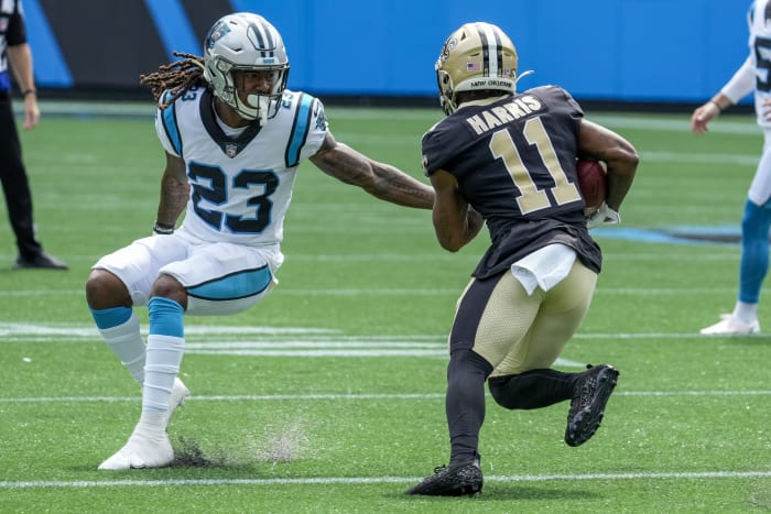 New Orleans Saints wide receiver Deonte Harris (11) tries to elude Carolina cornerback Stantley Thomas-Oliver III (23). Mandatory Credit: Jim Dedmon-USA TODAY Sports
